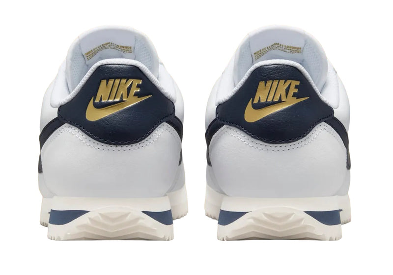 Women's Cortez Oly White/Obsidian-Sail (HJ9343 100)