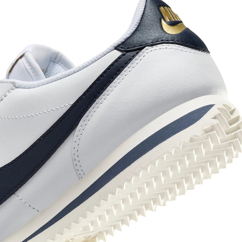 Women's Cortez Oly White/Obsidian-Sail (HJ9343 100)